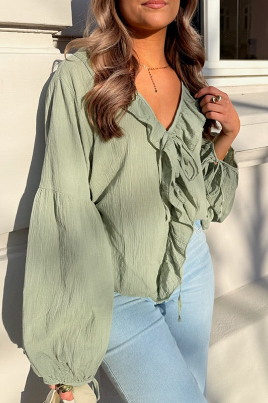 Mist Green Ruffle Trim V Neck Blouse by Chic Speak Boutique, featuring ruffle details and a V neckline in soft green fabric.