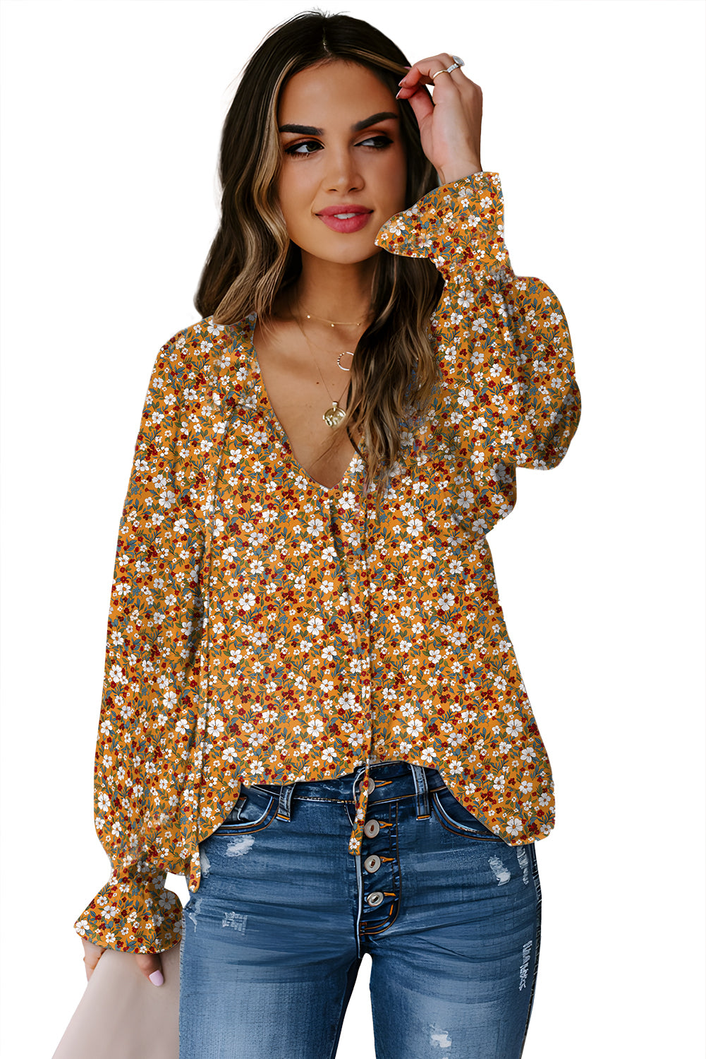 Orange floral ruffled bubble sleeve V-neck blouse from Chic Speak Boutique featuring a feminine design and eye-catching floral pattern.