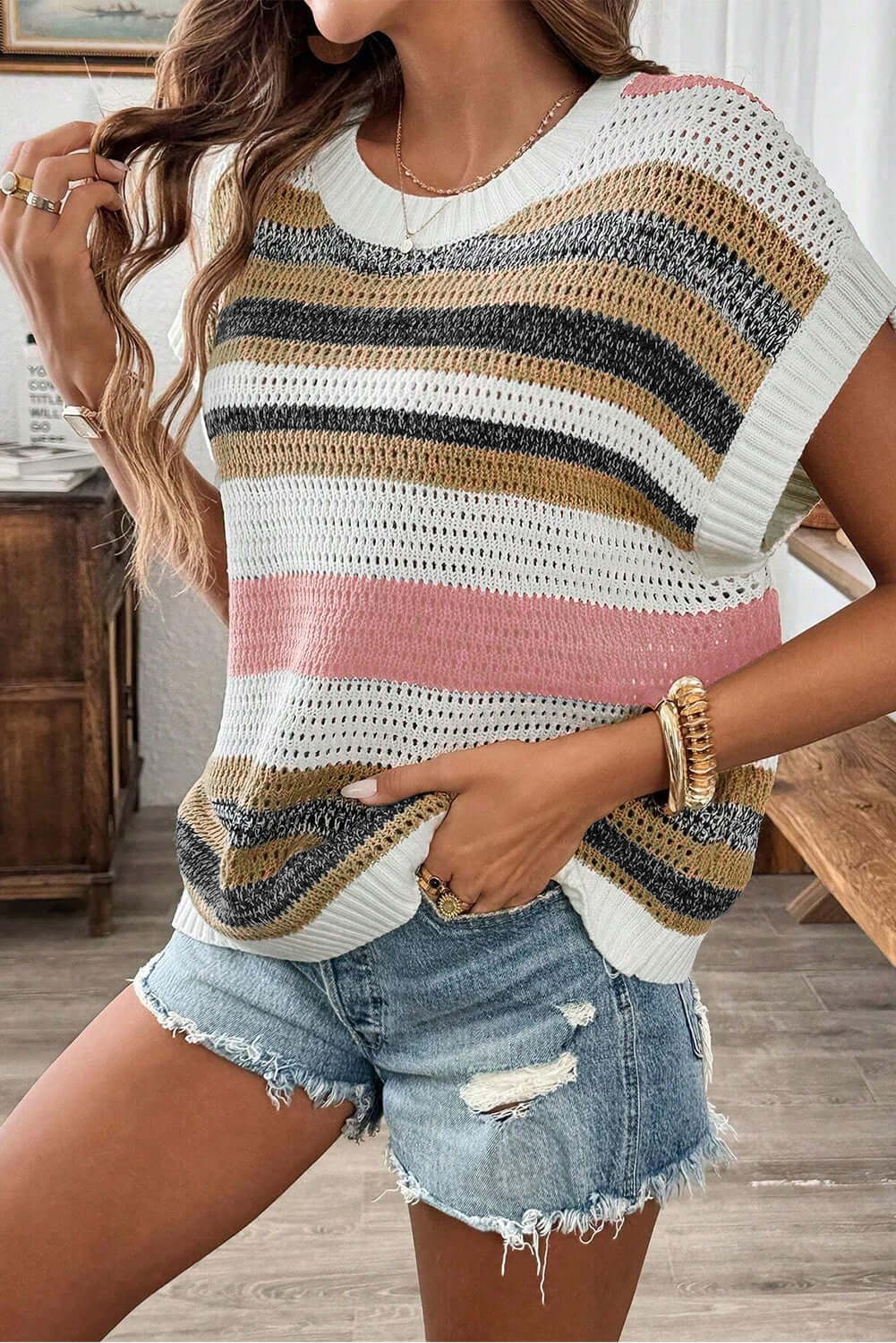 Pink stripe colorblock eyelet knit short sleeve sweater tee from Chic Speak Boutique, showing its vibrant pattern and lightweight fabric.