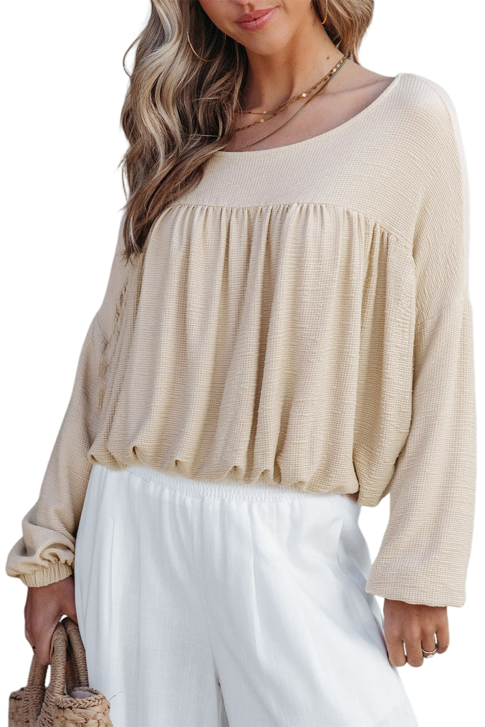 Chic Speak Boutique pleated long sleeve top in neutral color, featuring a relaxed fit and elegant design.