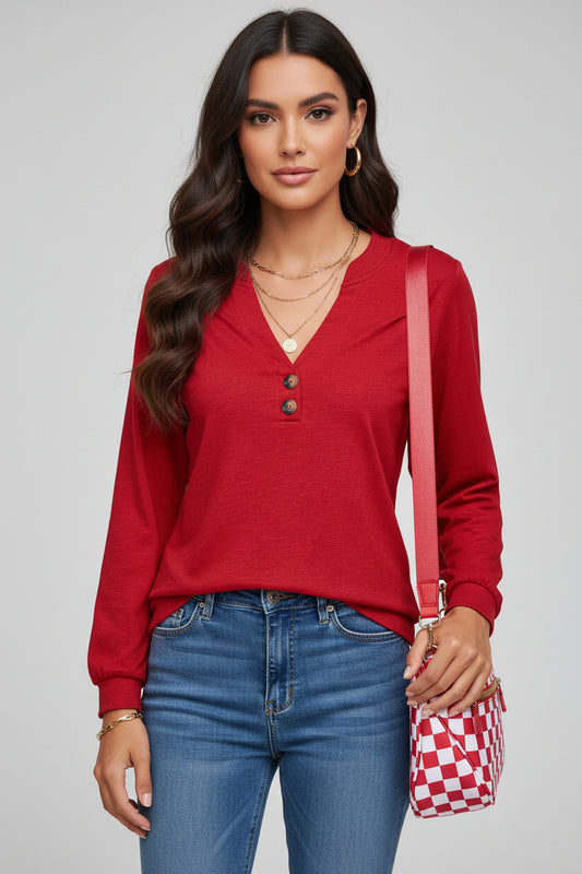 Chic Speak Boutique racing red V-neck long sleeve top displayed on a hanger with a casual fit and soft fabric.