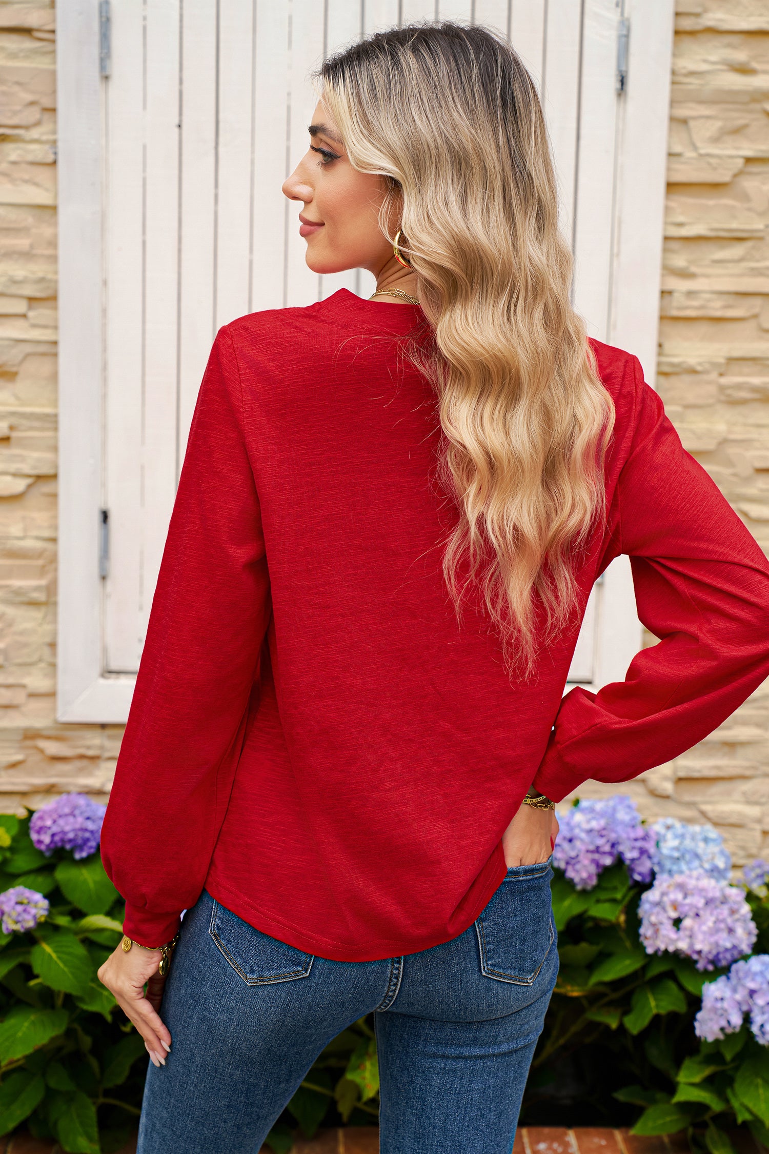Chic Speak Boutique racing red V-neck long sleeve top displayed on a hanger with a fitted silhouette.