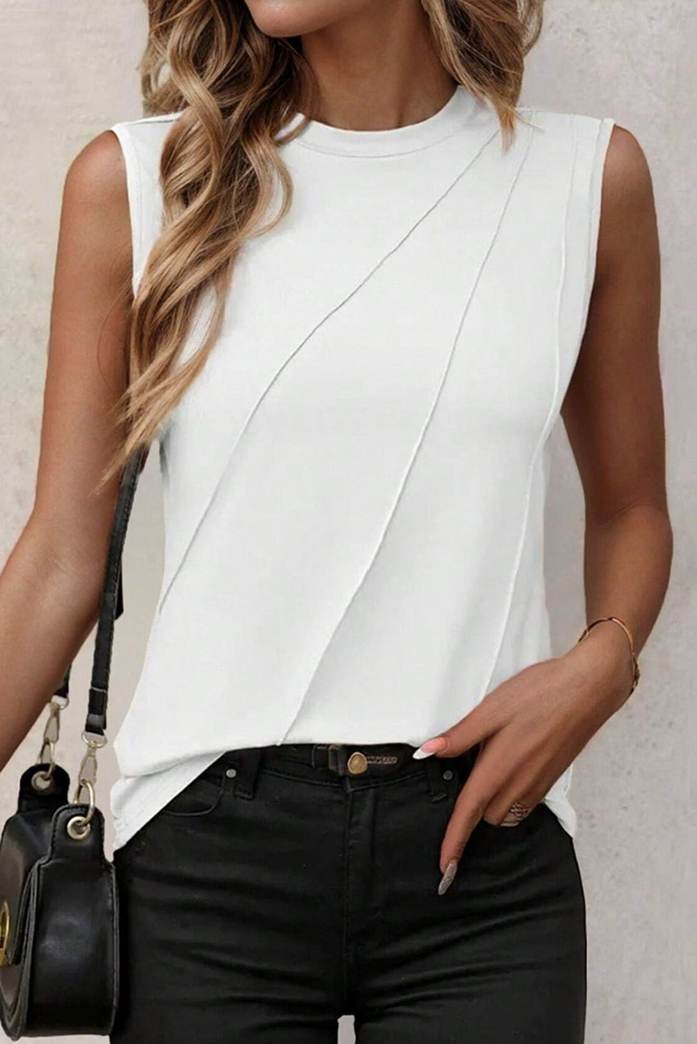 White pleated tank top by Chic Speak Boutique, featuring a sleeveless design and lightweight fabric for casual wear.