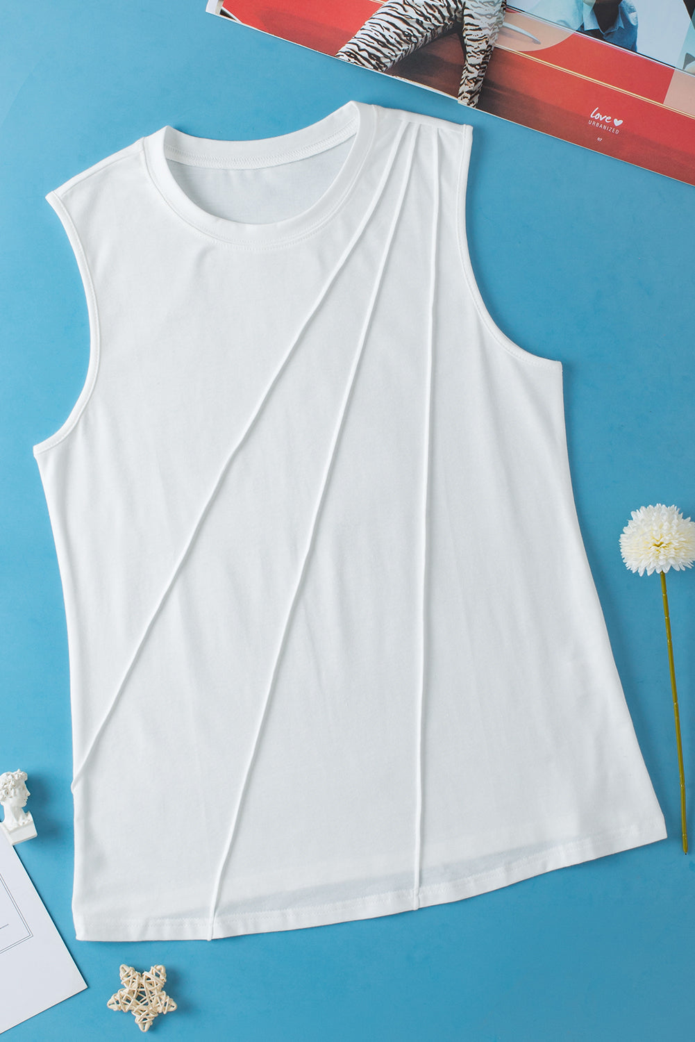 White pleated tank top from Chic Speak Boutique, featuring a sleeveless design and a flowy, stylish fit.