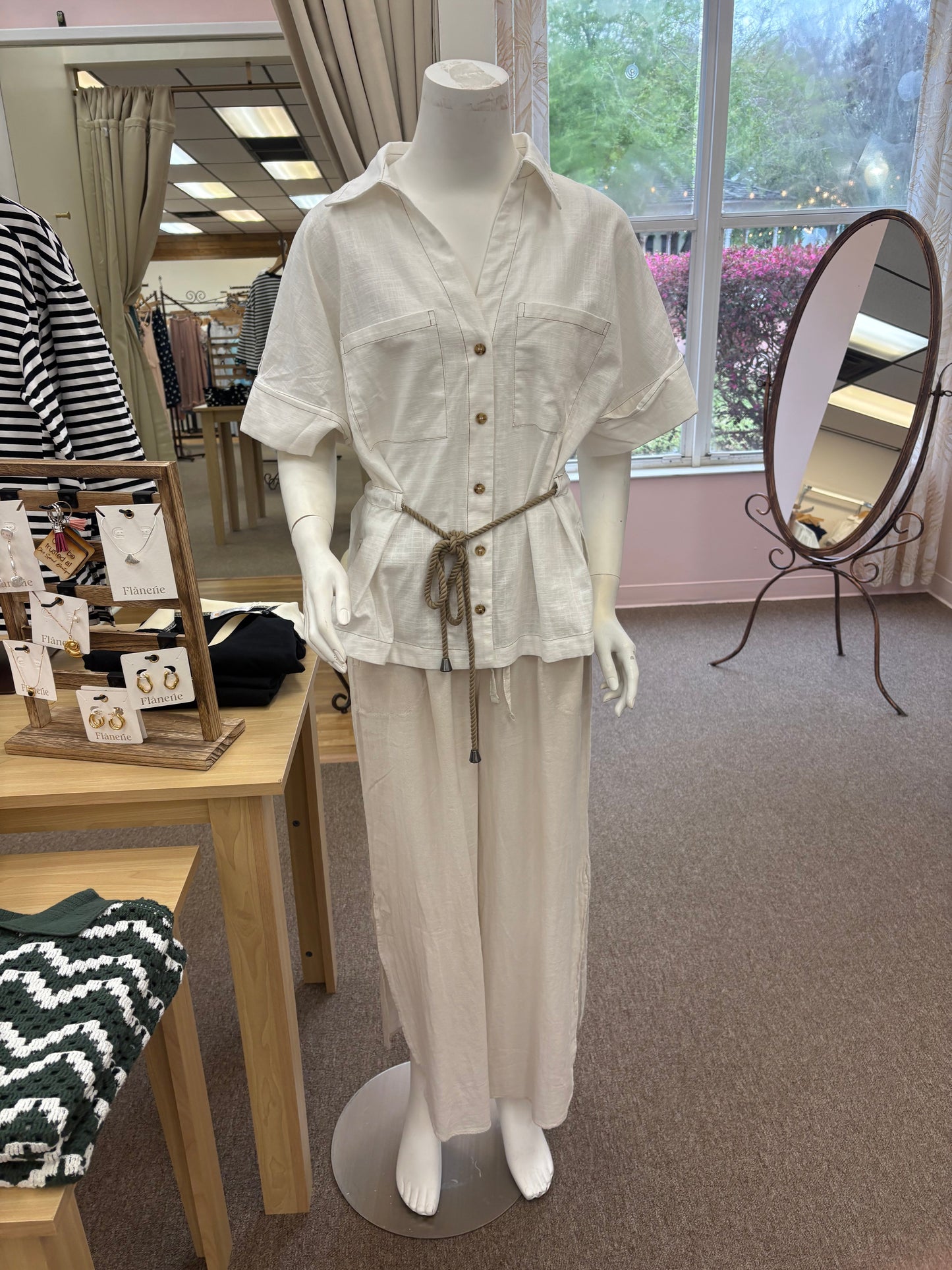 Cotton linen drawstring shirt from Chic Speak Boutique displayed flat, showcasing its lightweight, breathable fabric and relaxed fit style.