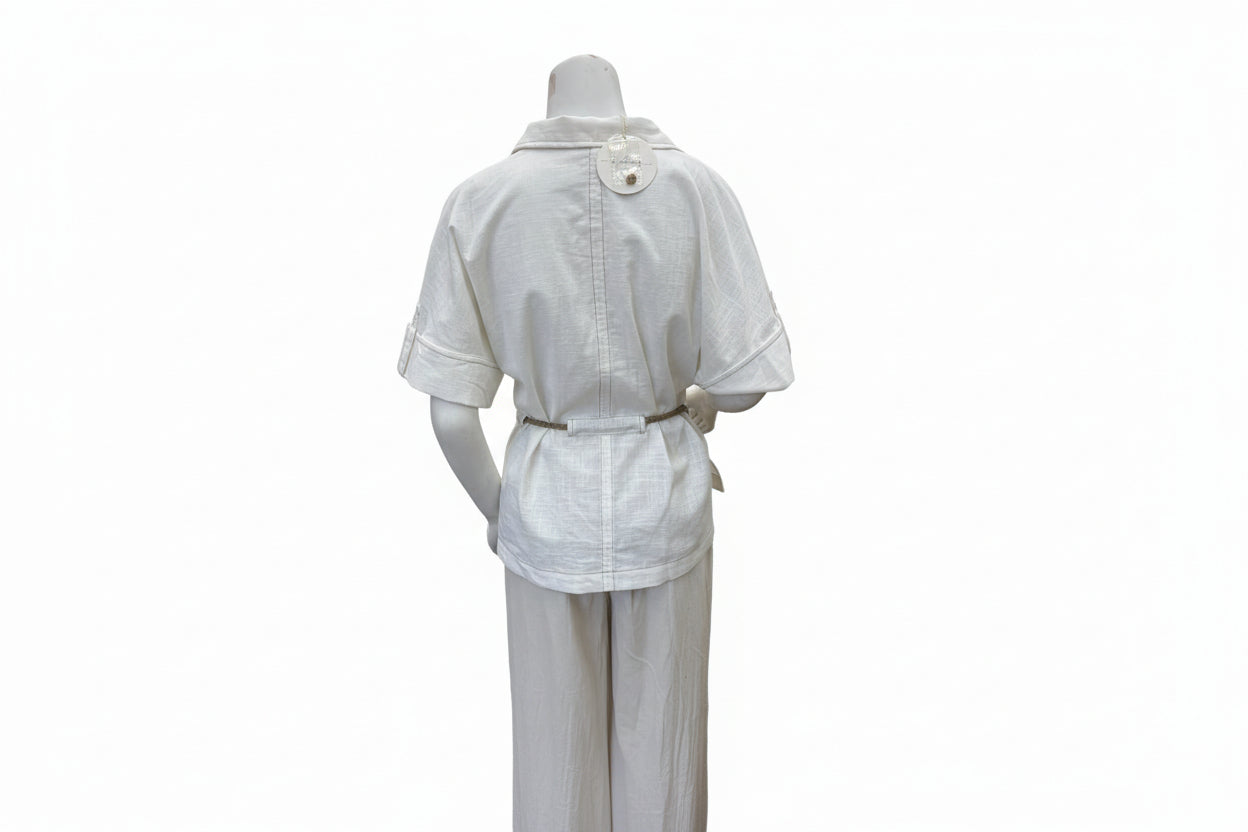Light-colored cotton linen drawstring shirt from Chic Speak Boutique, featuring a relaxed fit and casual style.