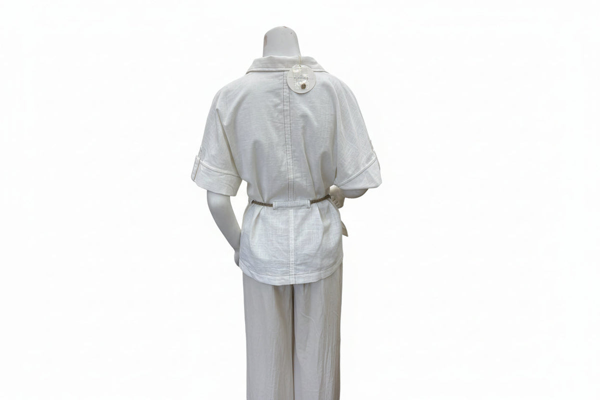 Light-colored cotton linen drawstring shirt from Chic Speak Boutique, featuring a relaxed fit and casual style.