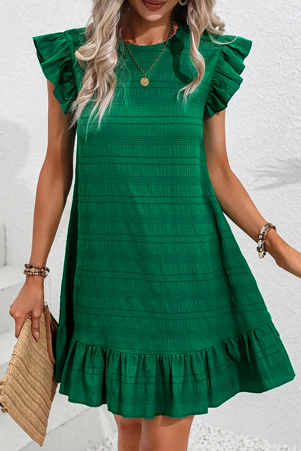 Dark green flutter sleeve mini dress by Chic Speak Boutique, featuring a stylish, flowy design and a flattering fit.