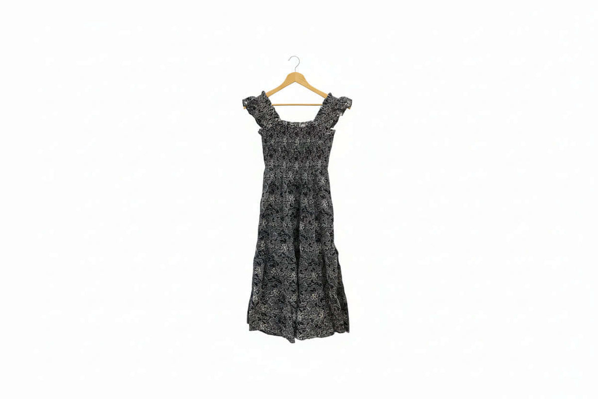 Navy embroidered smocked midi dress with puff sleeves and floral details, perfect for summer, by Chic Speak Boutique.