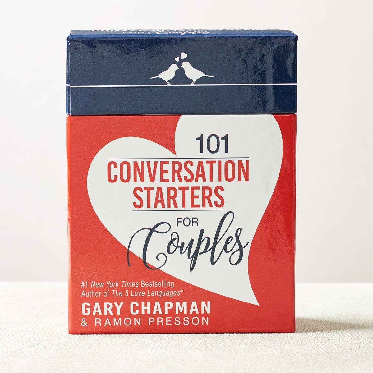 Open box of 101 Conversation Starters for Couples by Christian Art Gifts, featuring colorful cards with engaging questions.