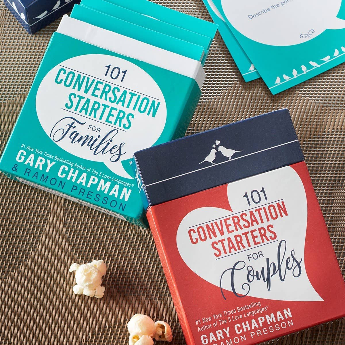 Open box of "101 Conversation Starters for Couples" by Christian Art Gifts, featuring cards with engaging questions for couples.