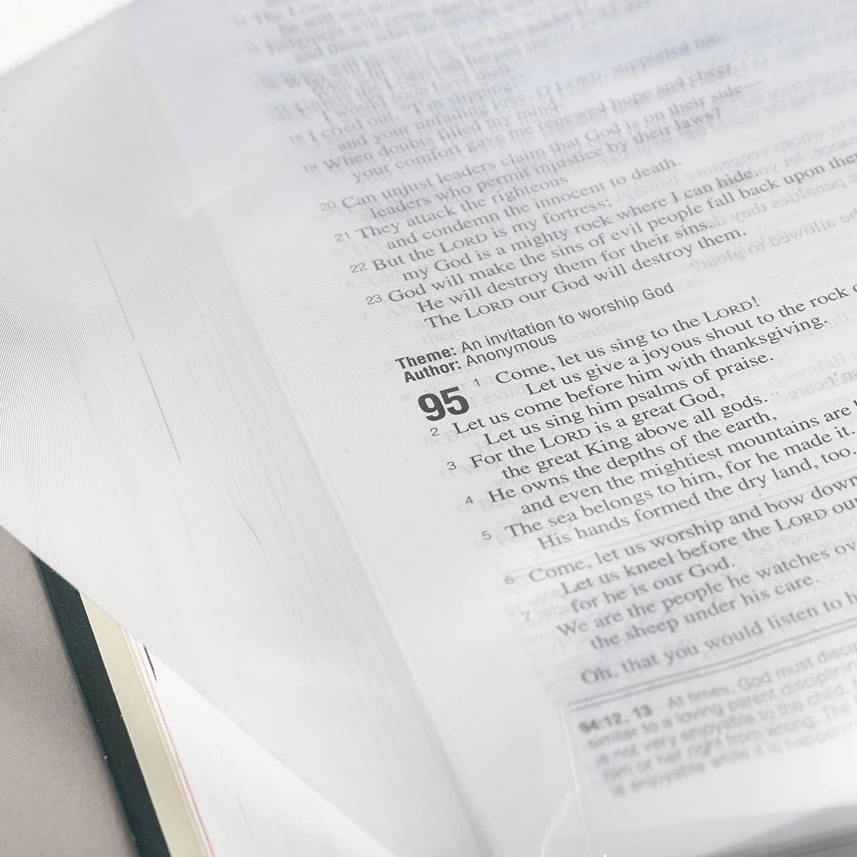 Christian Art Gifts magnifying sheet page with intricate religious artwork and detailed text for easy reading and devotional use.