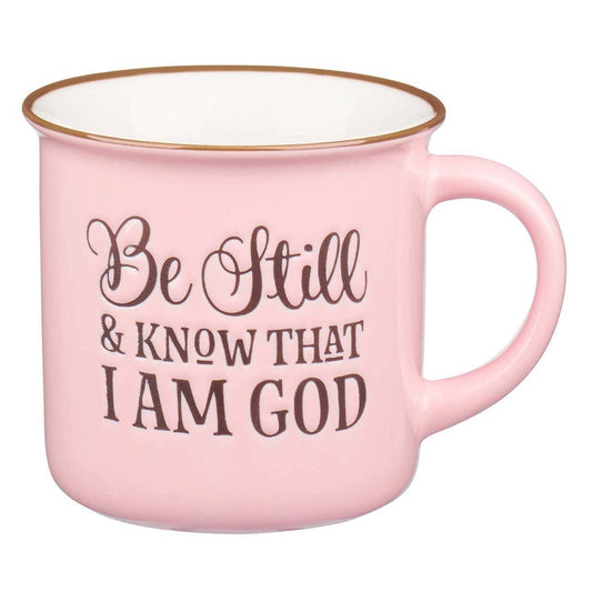 Pink and white ceramic mug with "Be Still & Know" Christian Art Gifts branding, featuring a motivational design on a white background.