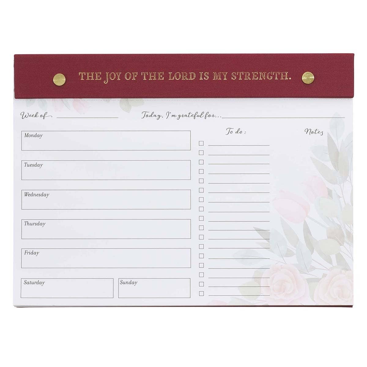 Undated planner pad in burgundy with "Joy of the Lord" Christian Art Gifts branding, featuring daily planning pages and decorative design.