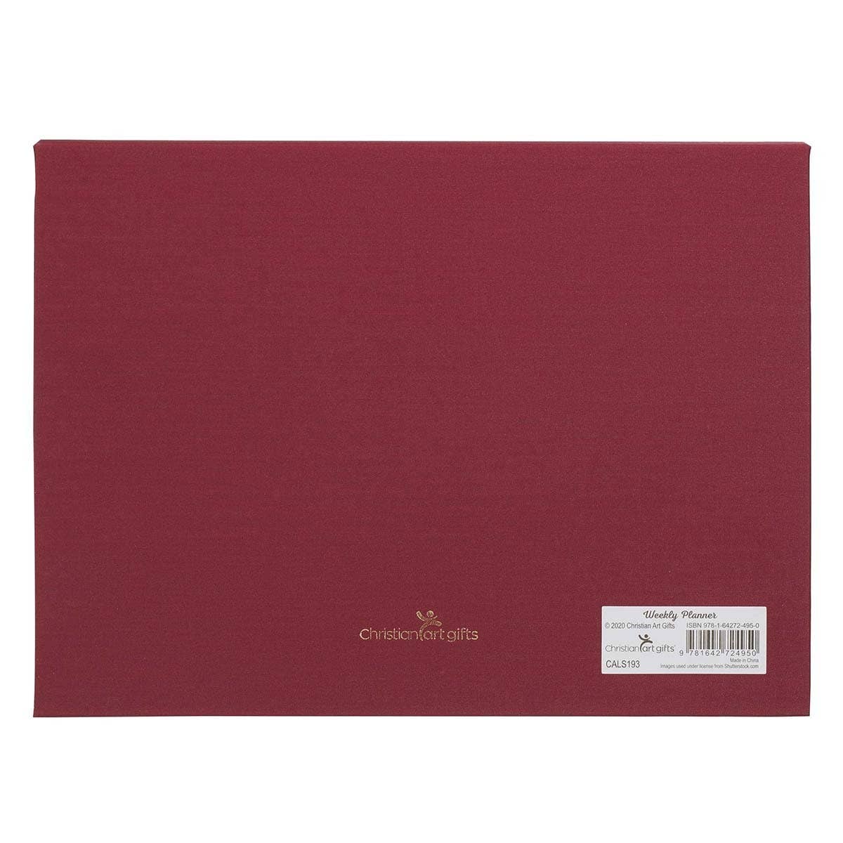 Undated planner pad by Christian Art Gifts with burgundy cover featuring "Joy of the Lord" design, ideal for daily planning.