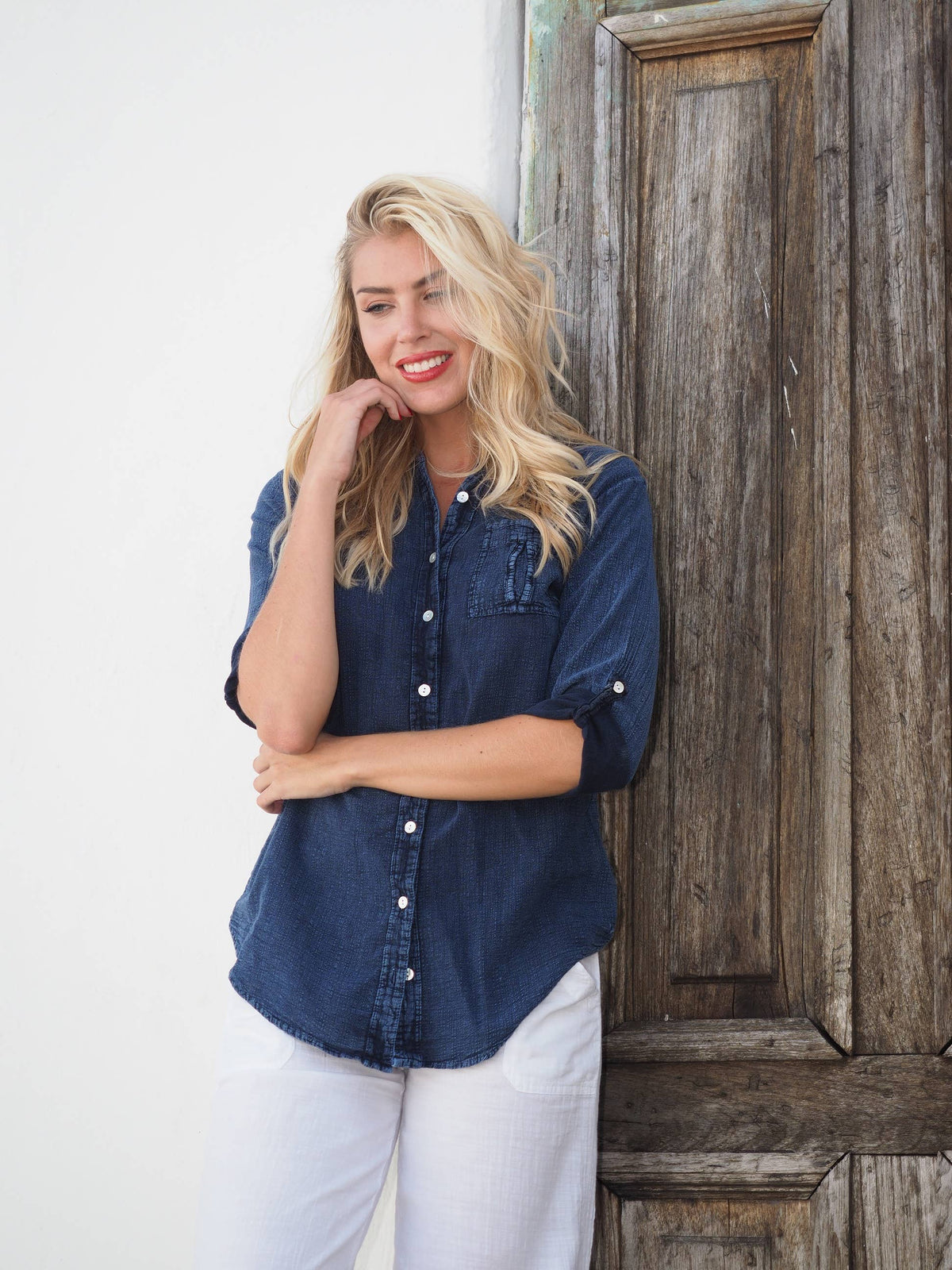 Kate Midnight Blue Shirt by Cotton Natural, displayed on a hanger with a close-up of the fabric and button details.