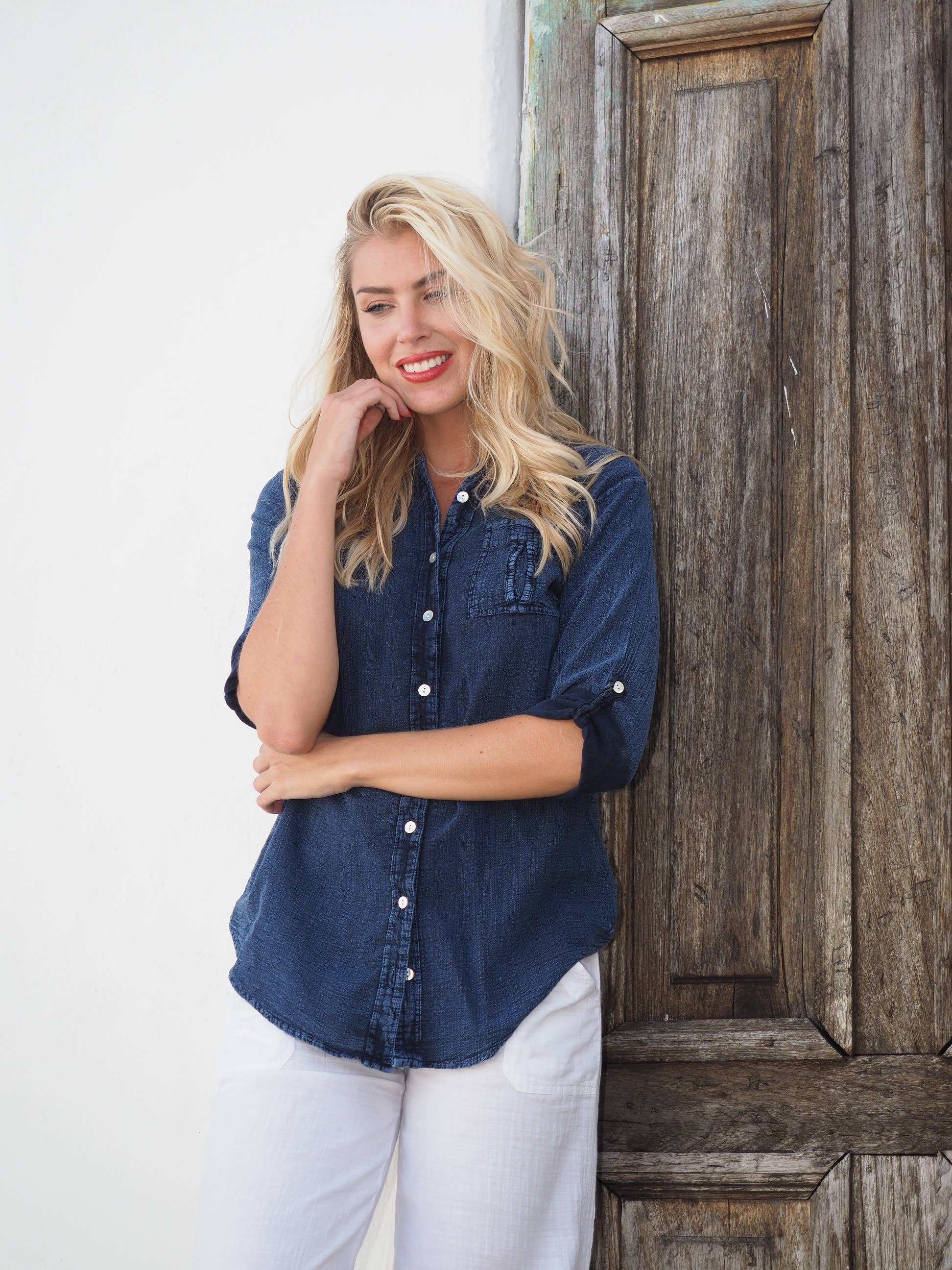 Kate Midnight Blue Shirt by Cotton Natural, displayed on a hanger with a close-up of the fabric and button details.