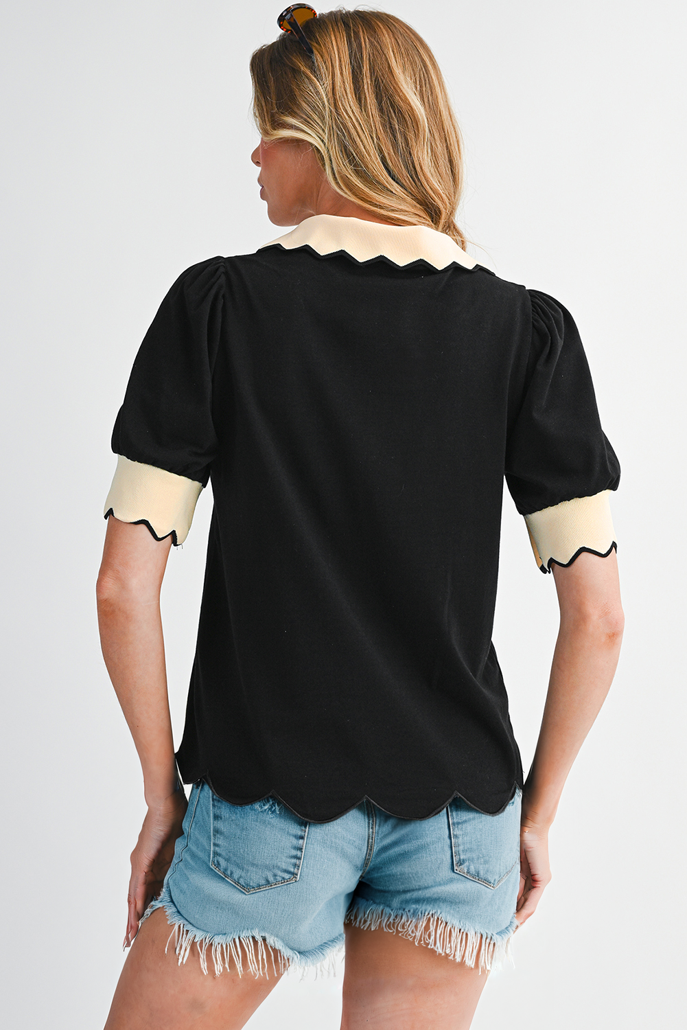 Black colorblock collared V-neck puff sleeve blouse by CSB Private Label, featuring a stylish design with contrasting color blocks.