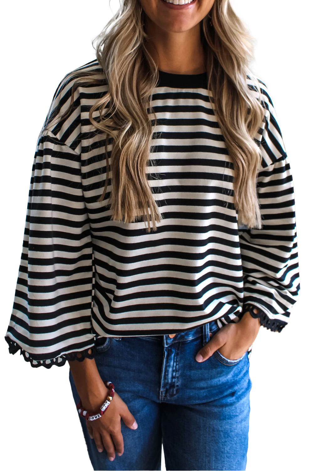 Black striped bell sleeve top from CSB Private Label featuring a relaxed fit and stylish bell sleeves.