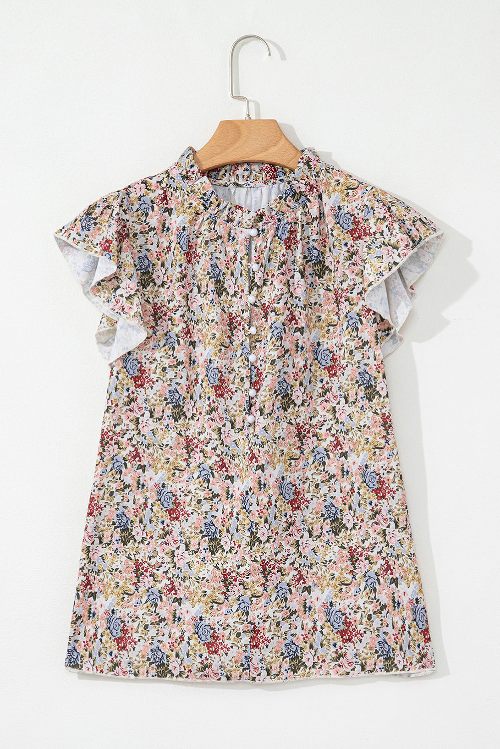 Short sleeve floral blouse by CSB Private Label featuring a colorful floral pattern and lightweight fabric.