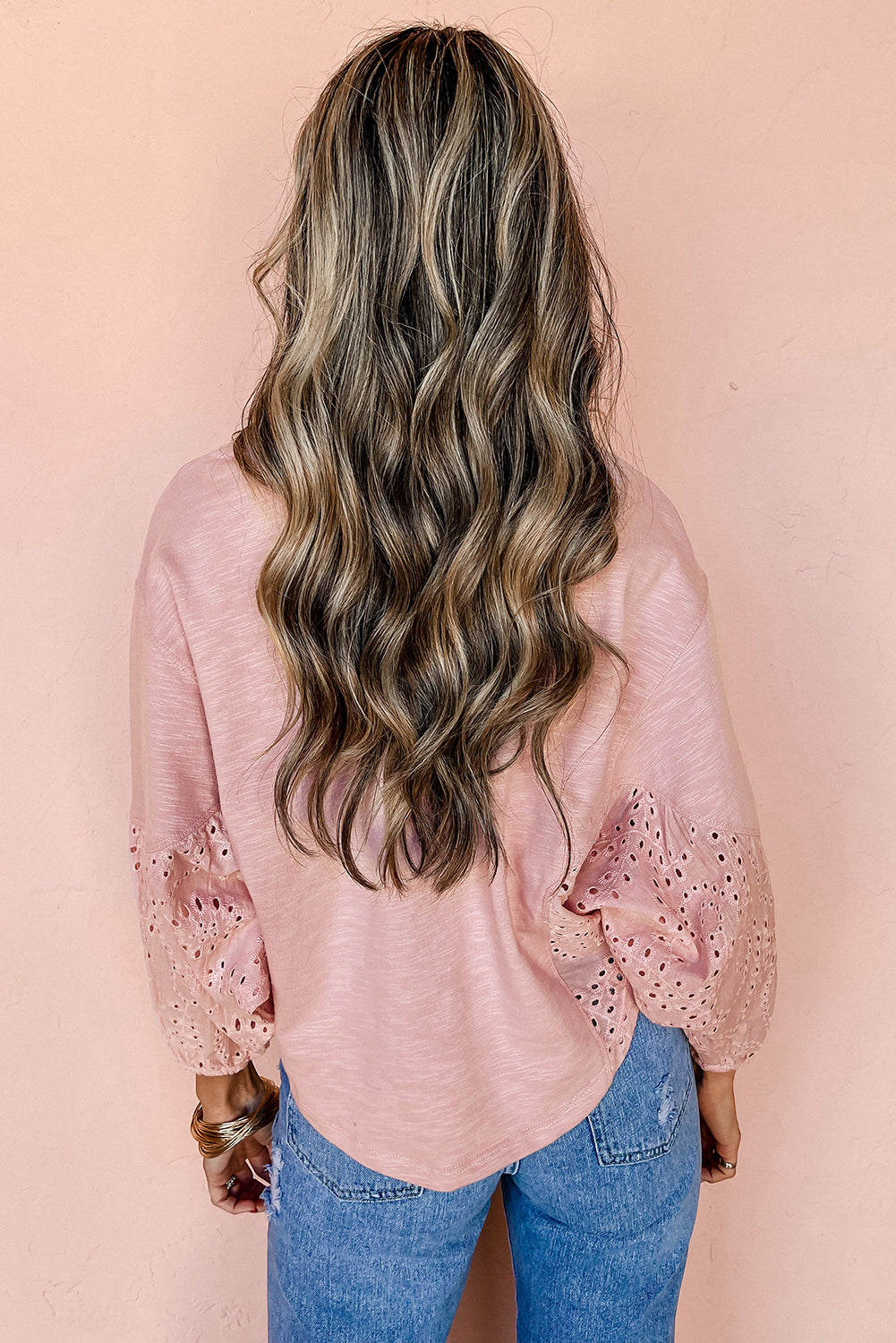 Light pink CSB Private Label notch V-neck batwing sleeve long-sleeve blouse with relaxed fit and stylish design.