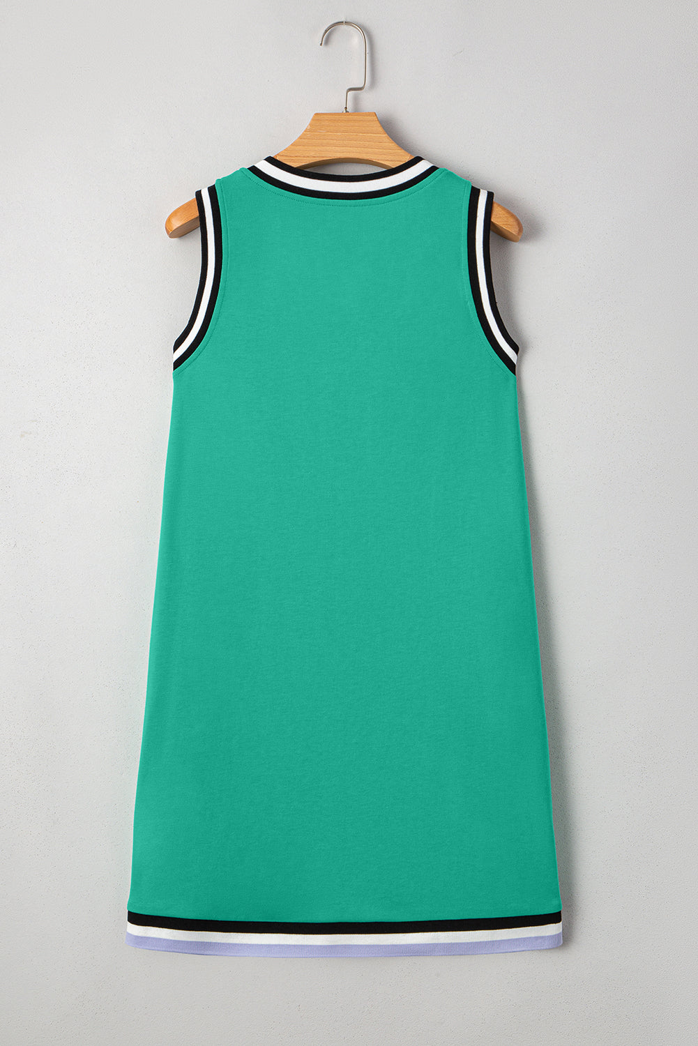 Mint green V-neck sleeveless mini dress with contrast trim by CSB Private Label, showing the dress's fitted silhouette and stylish design.