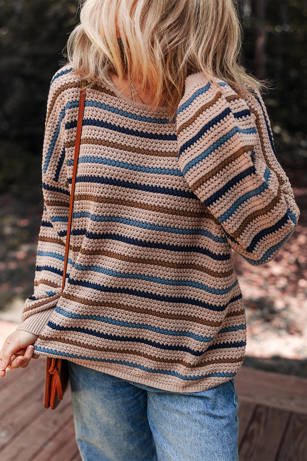 Multicolor striped knit sweater by CSB Private Label, featuring vibrant horizontal stripes and cozy knit fabric.