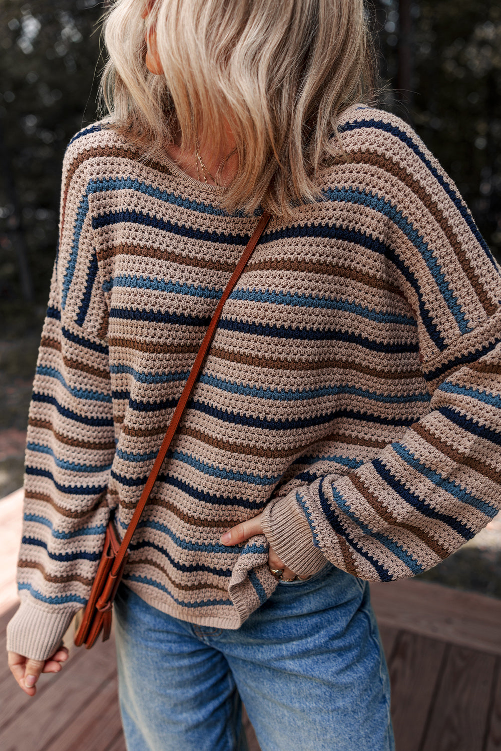 Multicolor striped knit sweater by CSB Private Label featuring a cozy, fitted design with vibrant horizontal stripes.