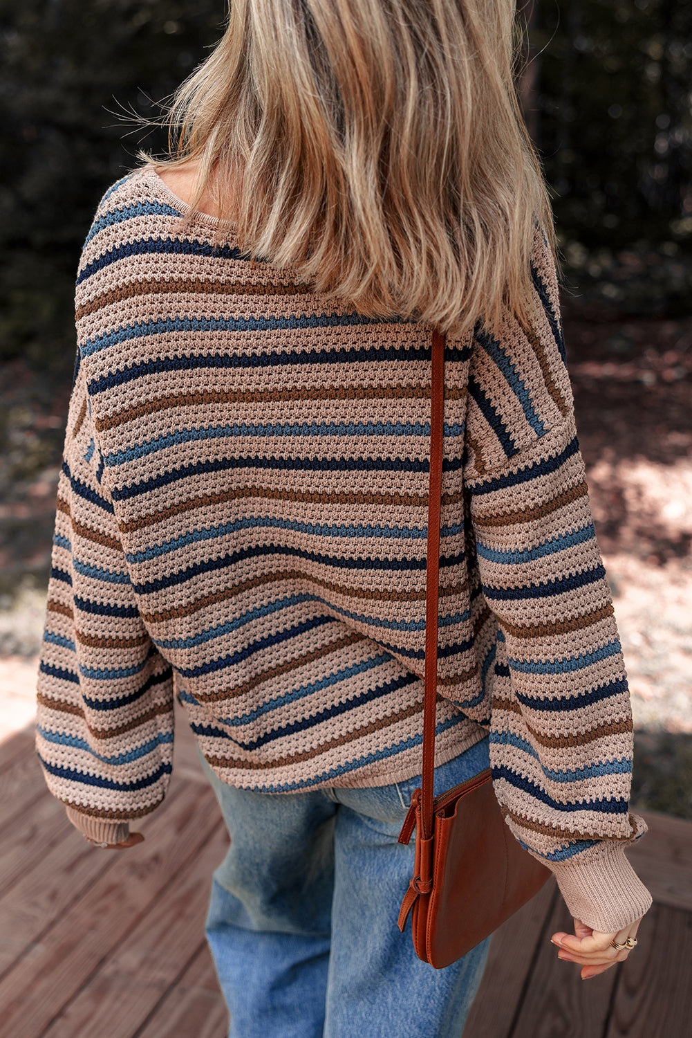 Multicolor striped knit sweater by CSB Private Label, featuring a cozy, multicolored design and ribbed cuffs and hem.