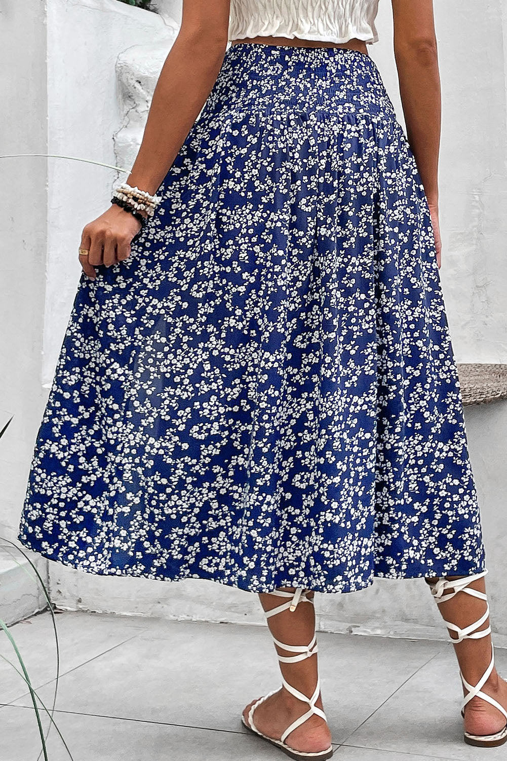 Navy blue and white floral skirt by CSB Private Label, featuring a flowy fabric and a stylish floral pattern.