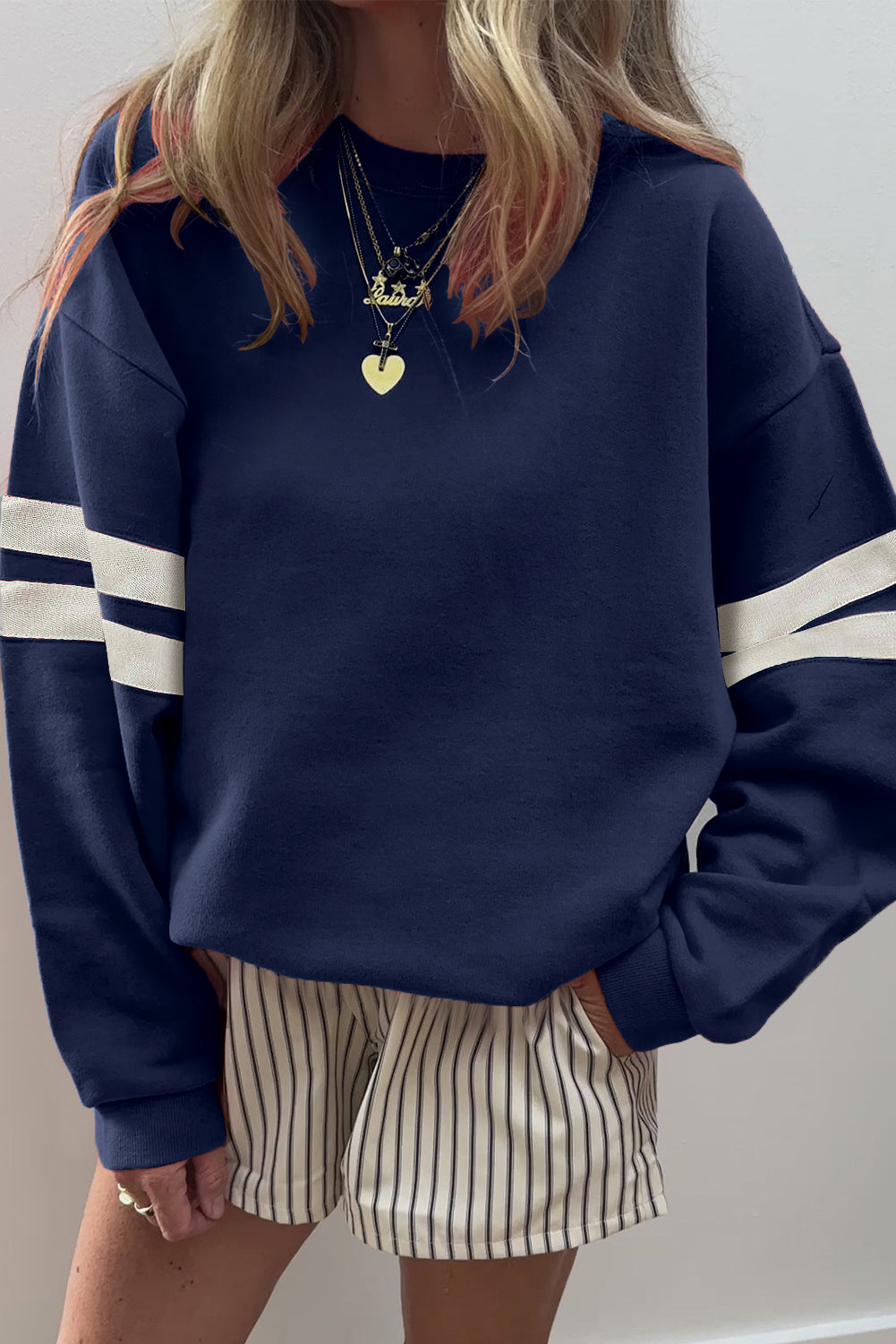 Navy collegiate stripe sweatshirt by CSB Private Label, featuring a classic crewneck design with contrasting stripe details.