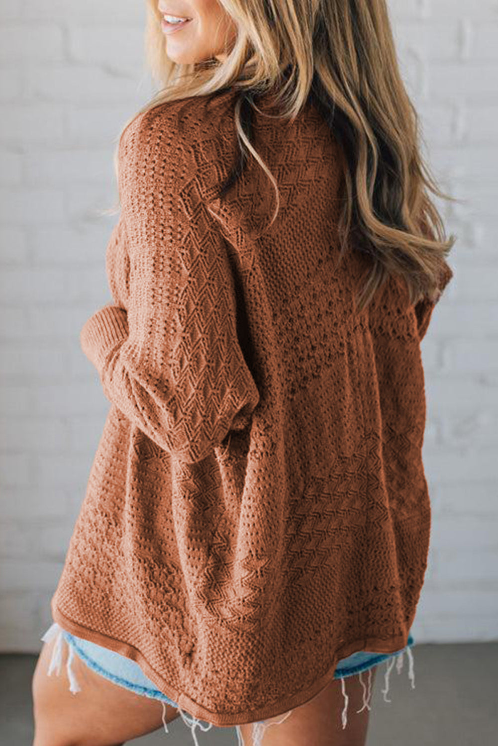 Open front CSB Private Label cardigan displayed flat, showing its soft knit fabric and lightweight design, ideal for casual wear.