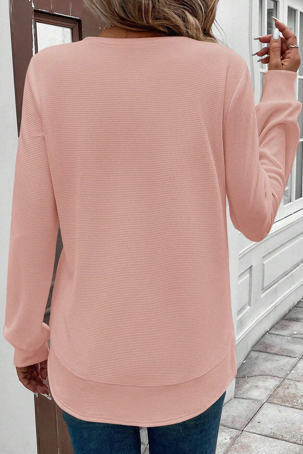 Pink waffle long-sleeve top with rounded hem from CSB Private Label, featuring a cozy textured fabric and casual fit.