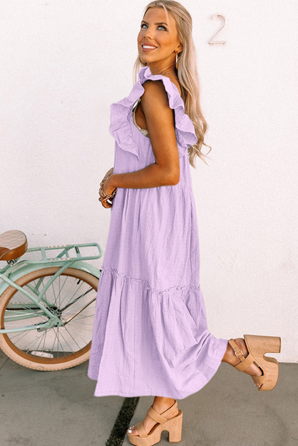 Purple ruffled flutter sleeve square neck textured tiered maxi dress by CSB Private Label, featuring flowing fabric and tiered design.