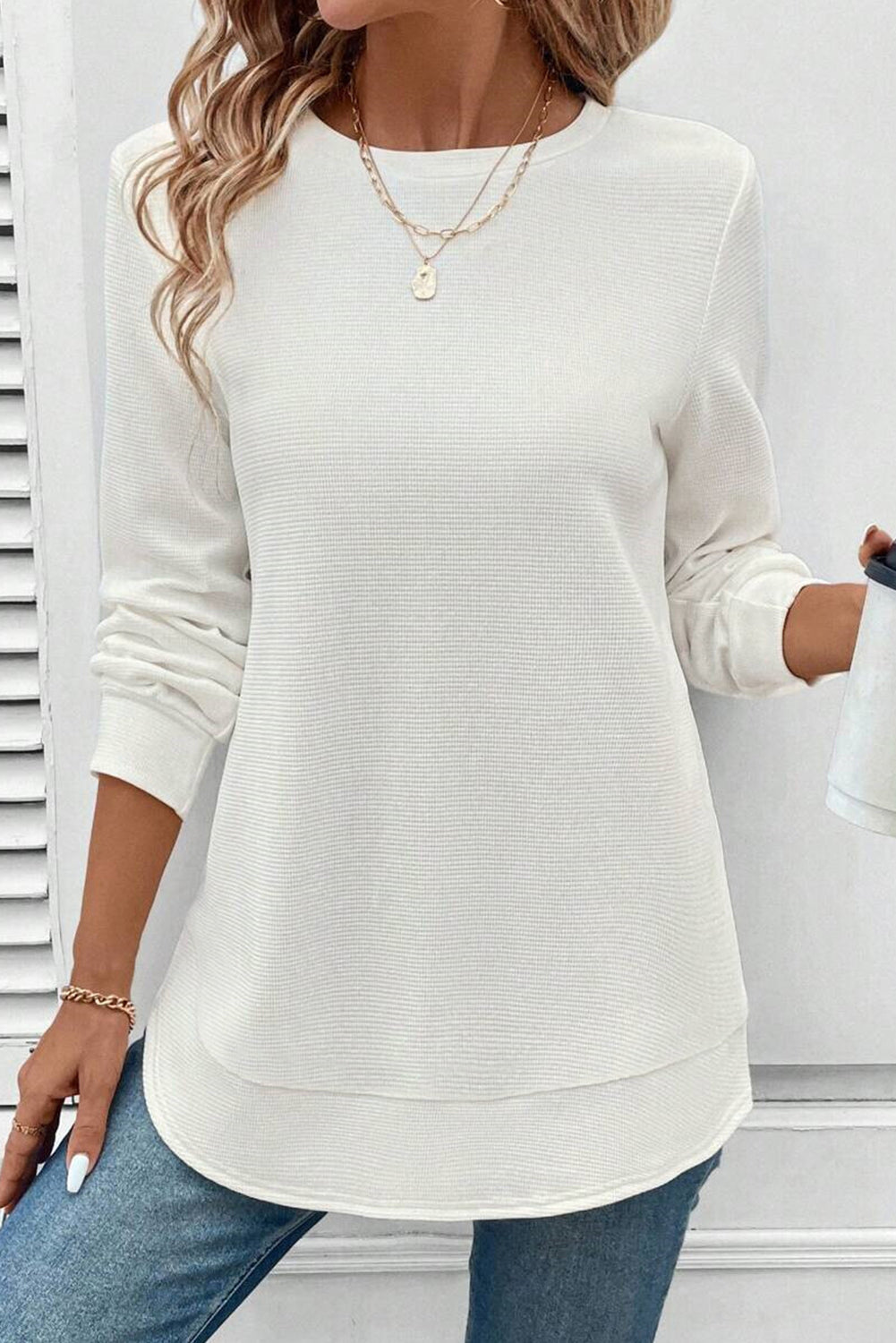 White rounded hem waffle long-sleeve top by CSB Private Label, showing the textured fabric and casual fit.