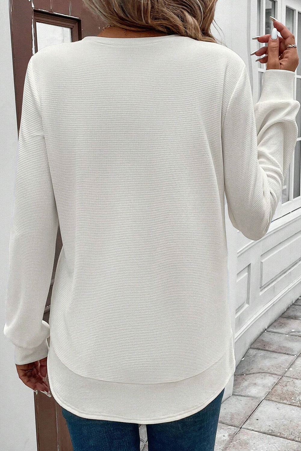 White rounded hem waffle long-sleeve top by CSB Private Label, showing the textured fabric and casual fit.
