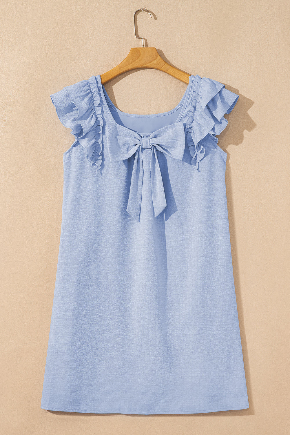 Elegant short dress with bow detail by CSB Private Label, featuring a stylish design perfect for casual or semi-formal occasions.