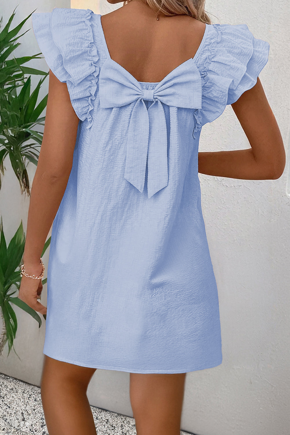 CSB Private Label short dress with bow, stylish and lightweight, featuring a fitted bodice and flared skirt for a feminine look.