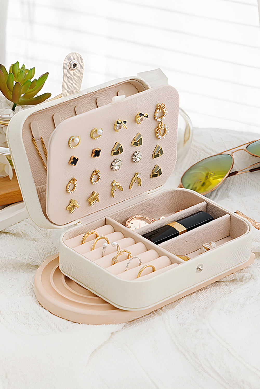 CSB Private Label jewelry travel box with multiple compartments for organizing necklaces, rings, and earrings.