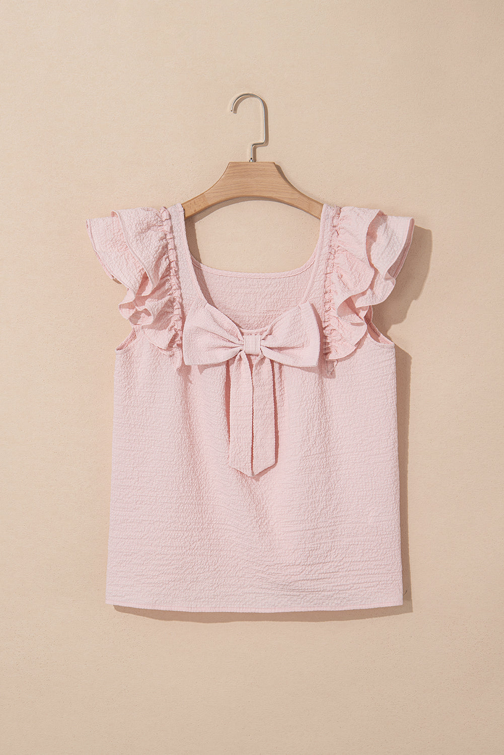 Ladies pink bow blouse by CSB Private Label, featuring a stylish bow detail and lightweight fabric, displayed on a mannequin.