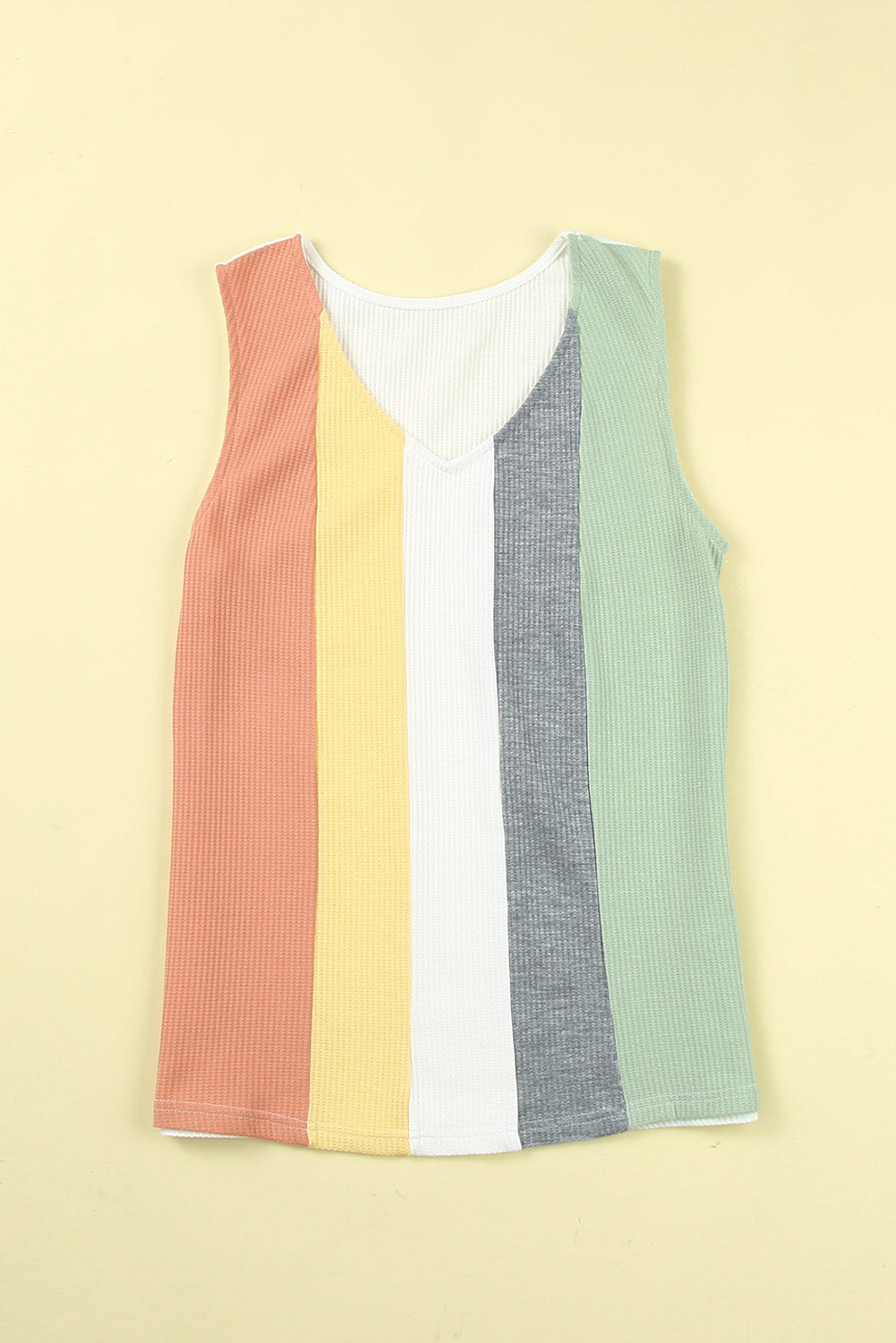 Multicolor sleeveless knit top by CSB Private Label featuring vibrant, multicolored yarn and a stylish, sleeveless design.