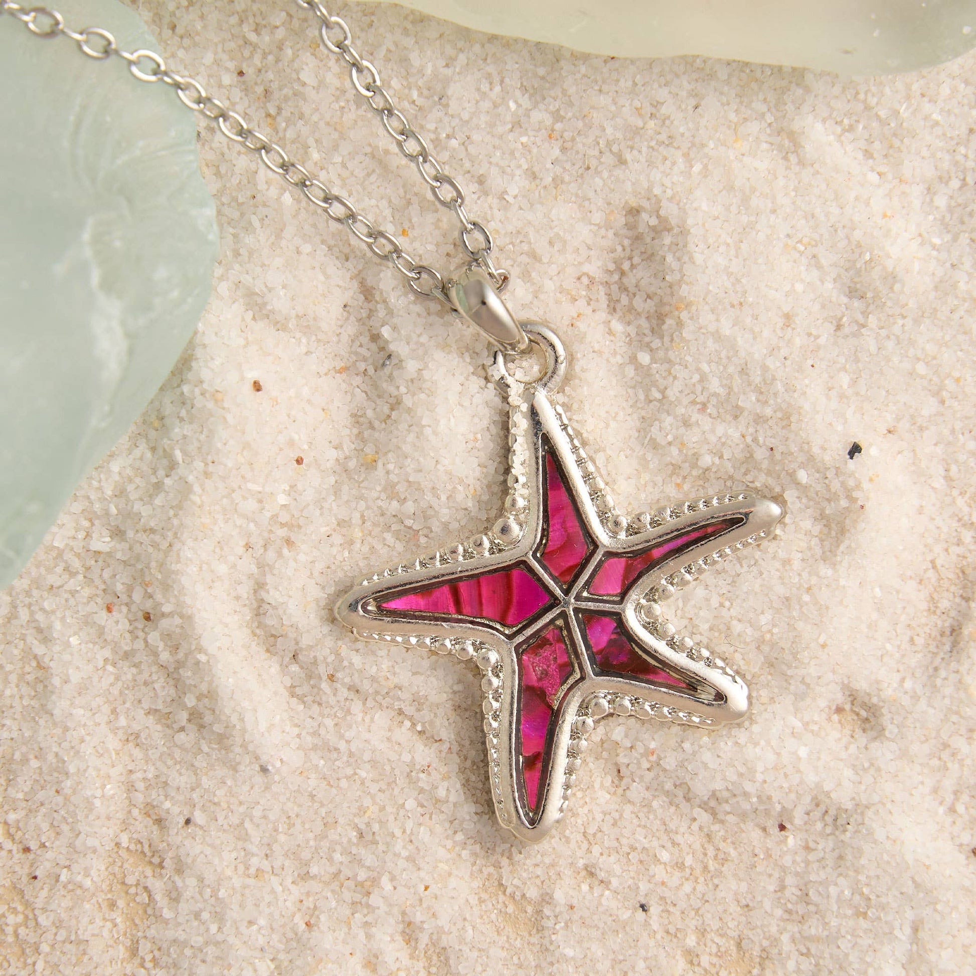 Abalone shell starfish pendant necklace featuring beach-inspired jewelry with natural oceanic design.