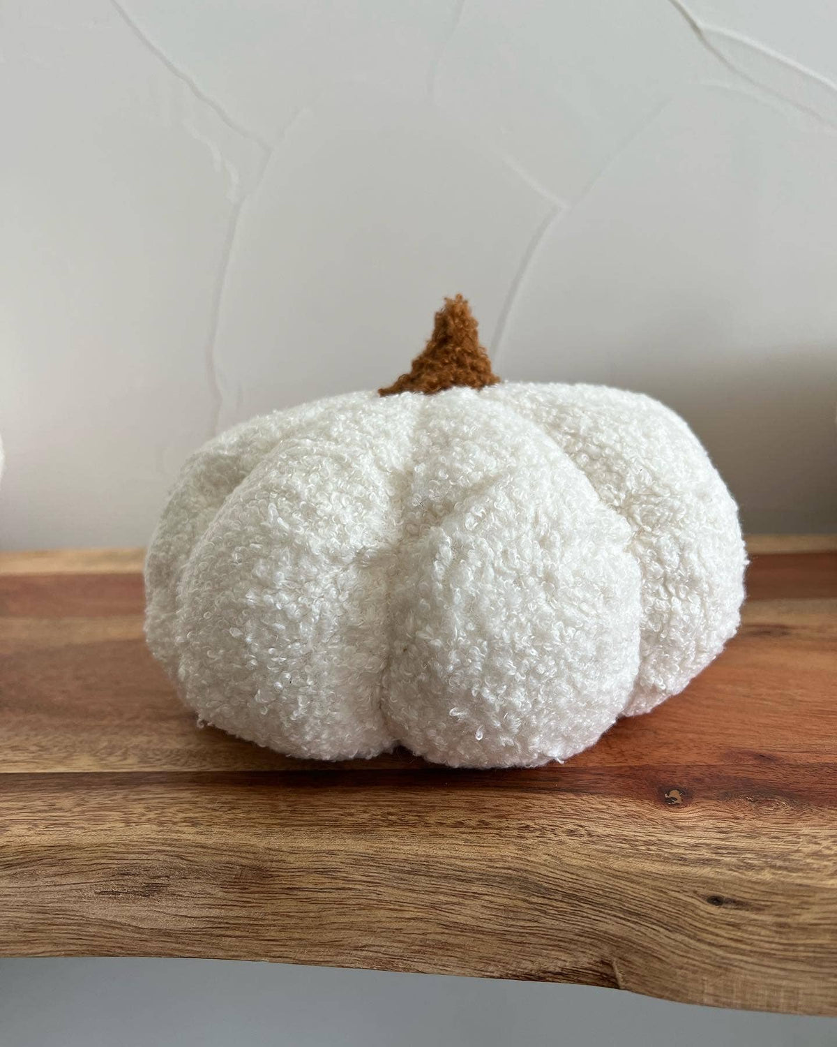 Pumpkin-themed fall boucle pillow by Delmar Decor, full decorative pillow with textured fabric and autumn-inspired design.