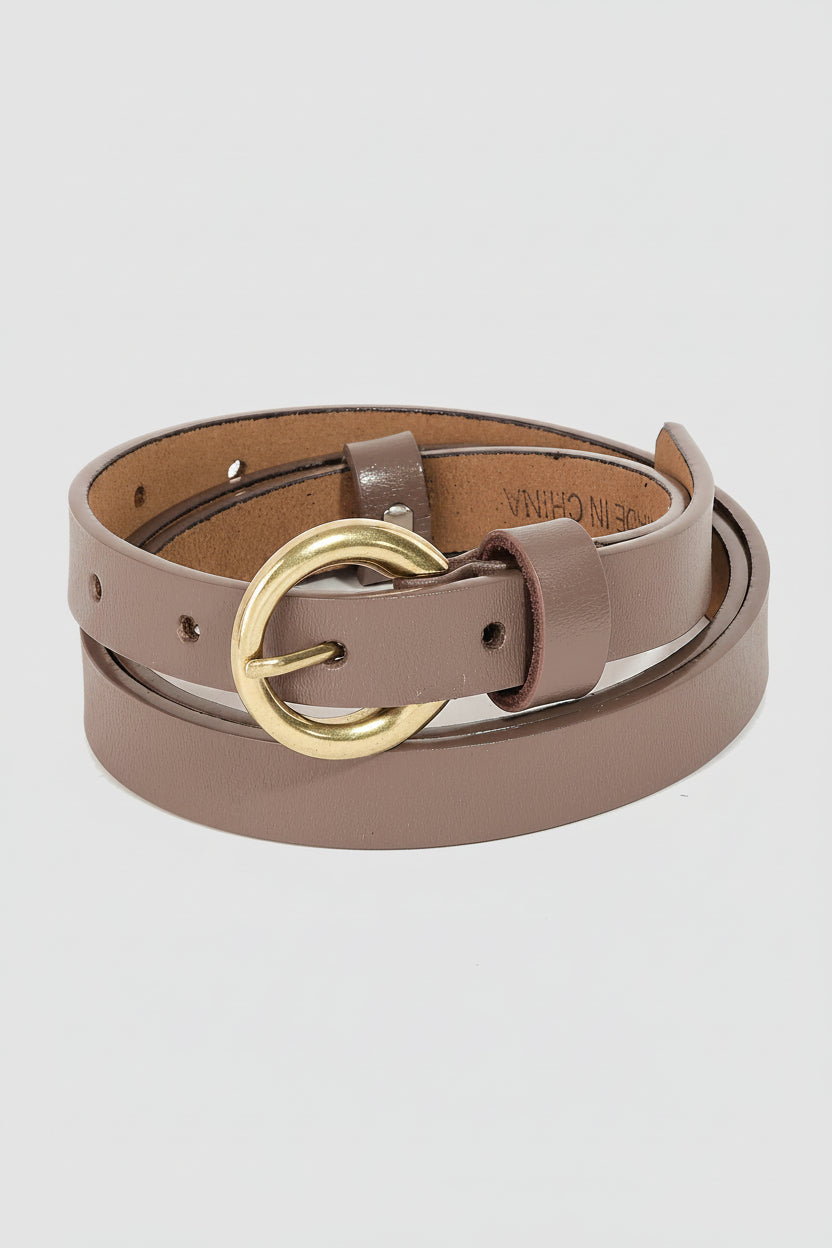 Brown leather belt with a gold buckle on a beige background