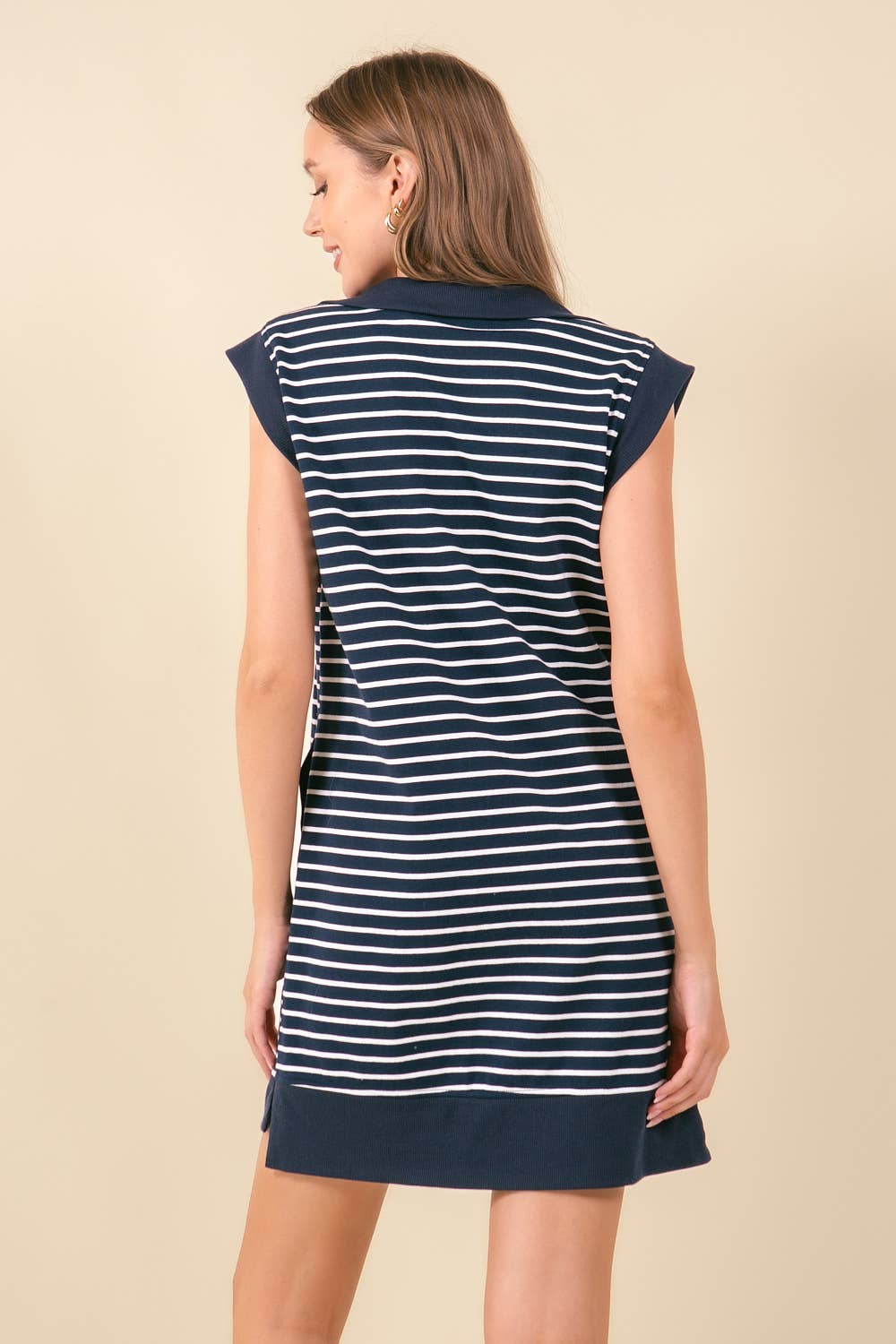 Doe and Rae striped mini dress with pockets, featuring a fitted silhouette and stylish design, perfect for casual or daytime wear.