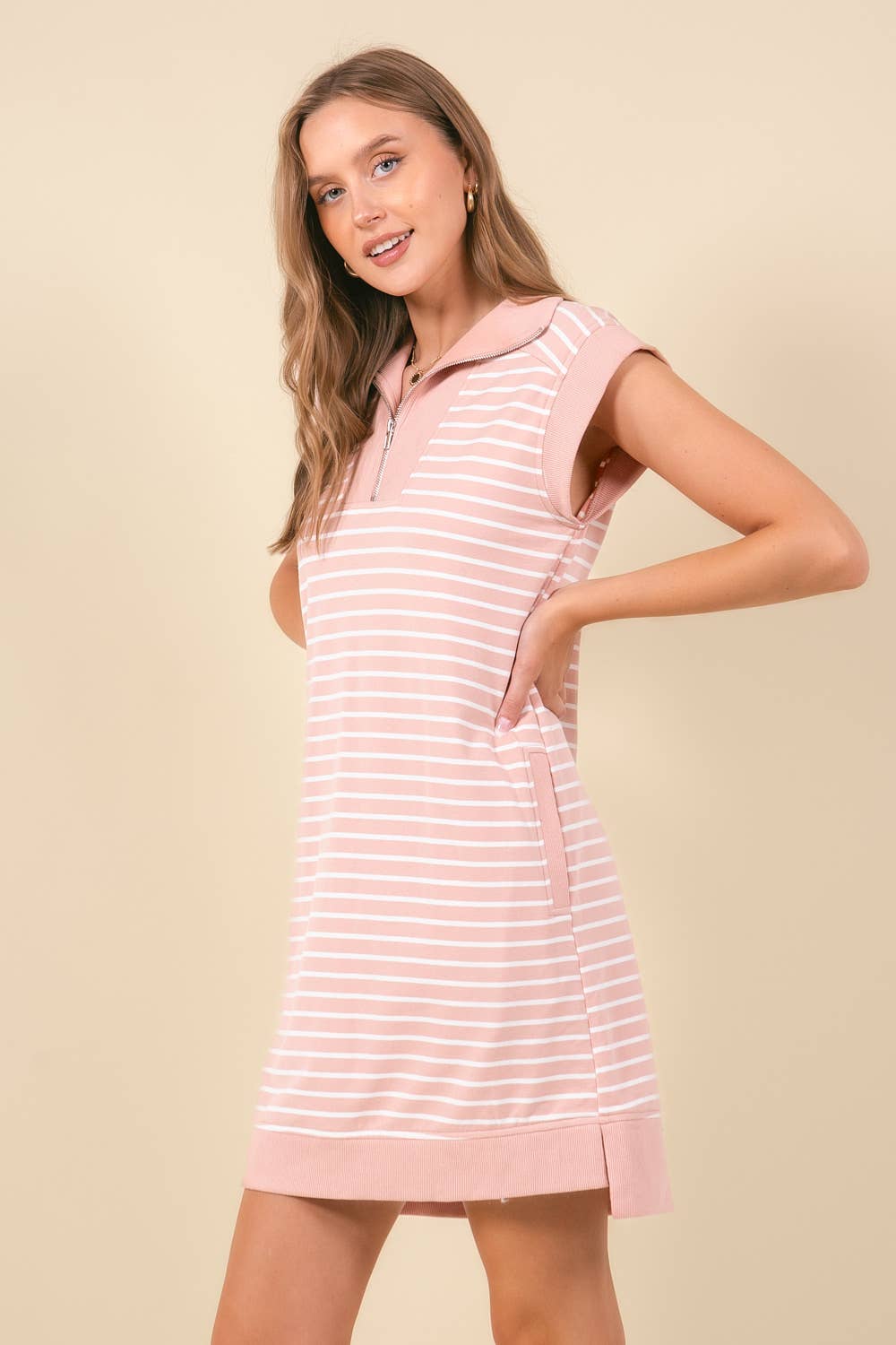 Doe and Rae striped mini dress with pockets, featuring a casual fit and colorful vertical stripes in a close-up front view.