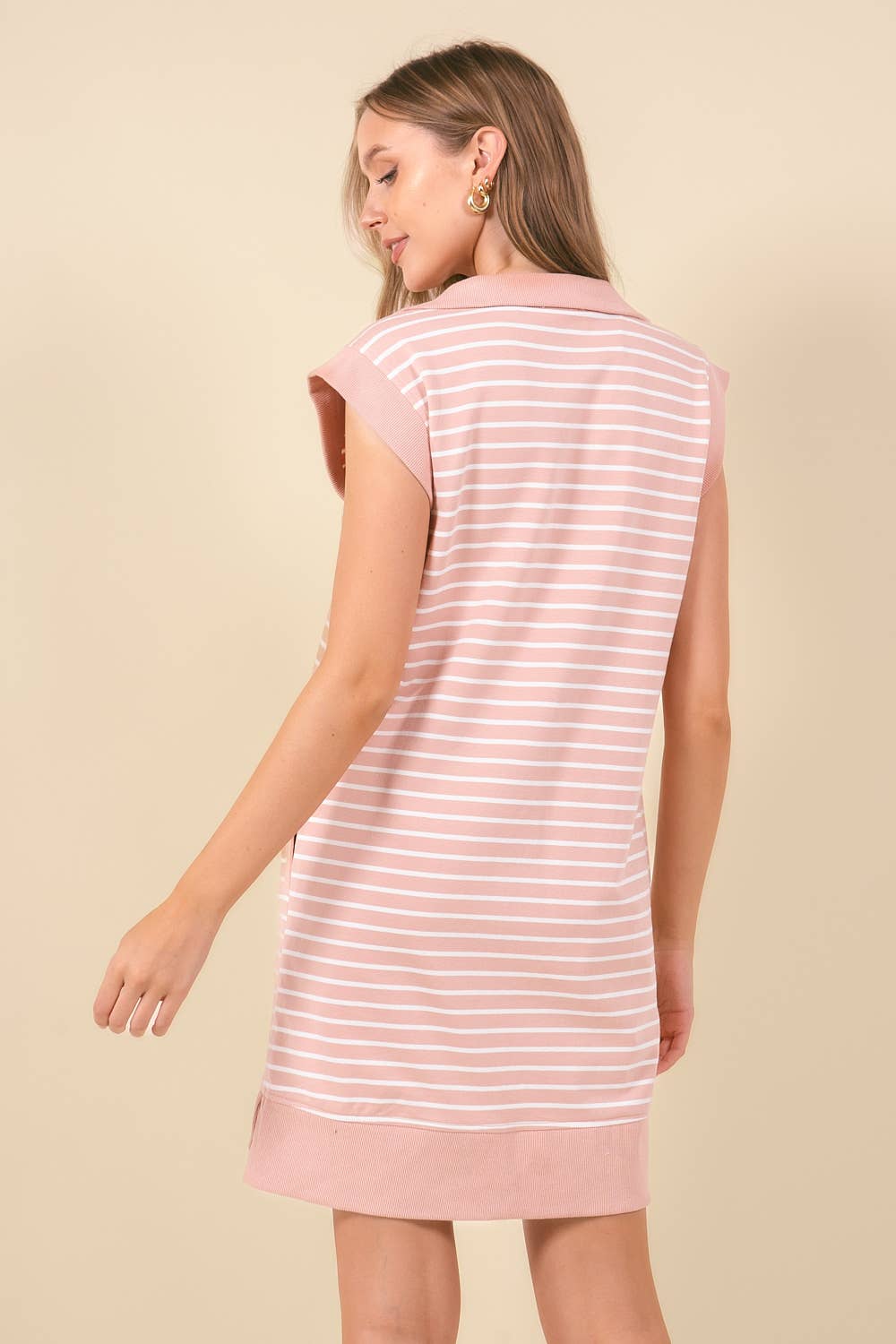 Striped mini dress with pockets from Doe and Rae, featuring a fitted silhouette and stylish design perfect for casual wear.