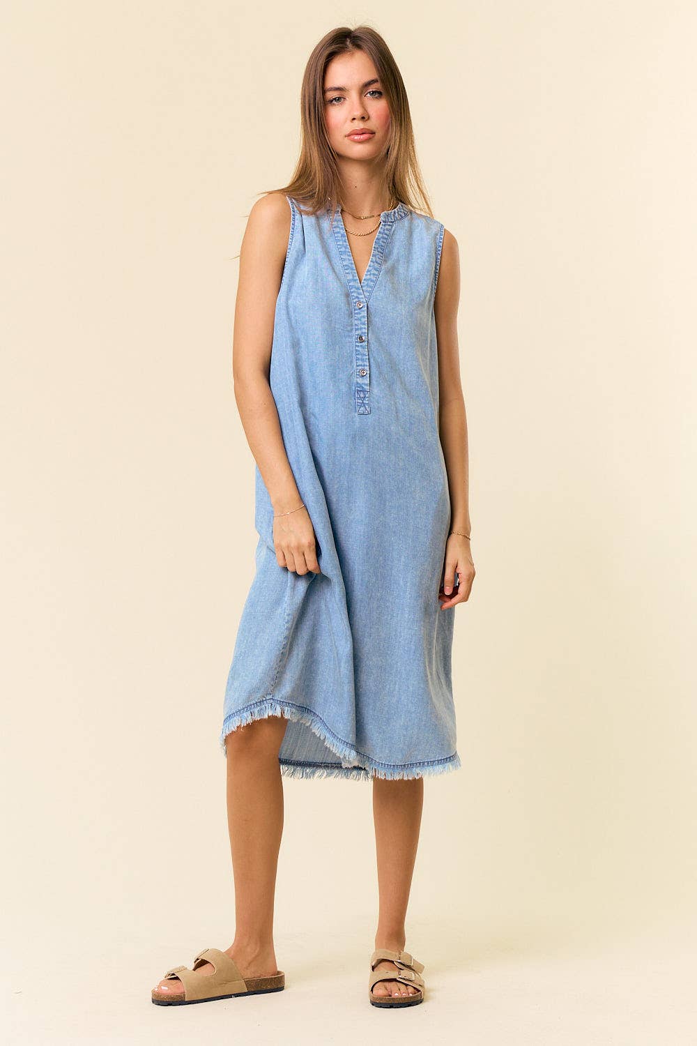 Doe and Rae Tencel denim knee-length sleeveless Henley dress featuring a relaxed fit and classic button-front design.
