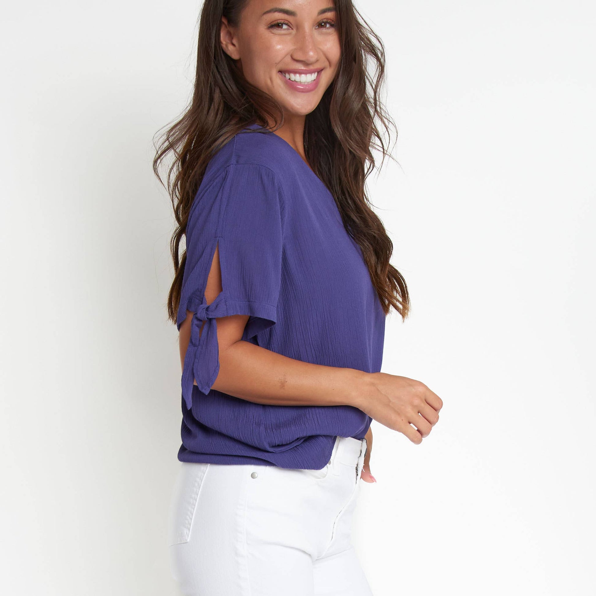 Elsie & Zoey Nika Crepe tied short sleeve V-neck blouse, lightweight fabric with a relaxed fit and stylish design.