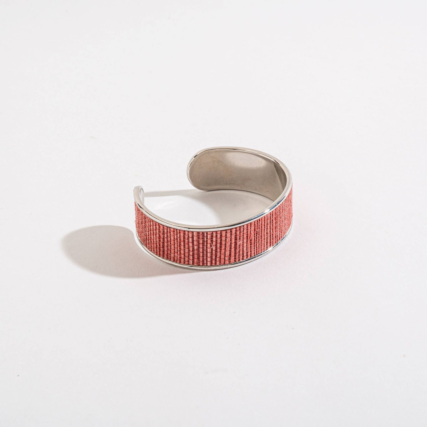 Elsie & Zoey Harper cuff bracelet, beach jewelry with metallic finish and adjustable fit, laid flat on a neutral background.